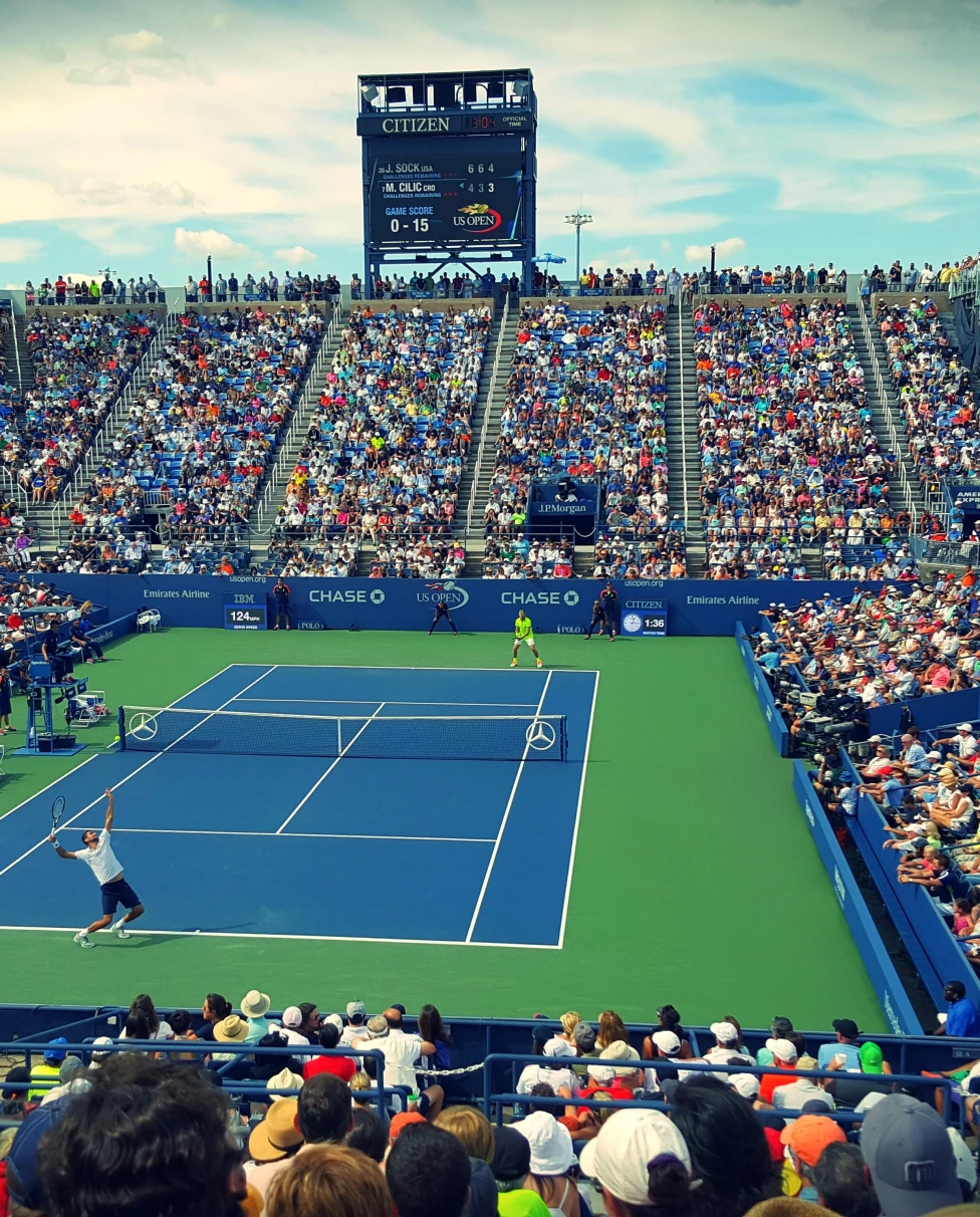 large crowded tennis stadium during daytime