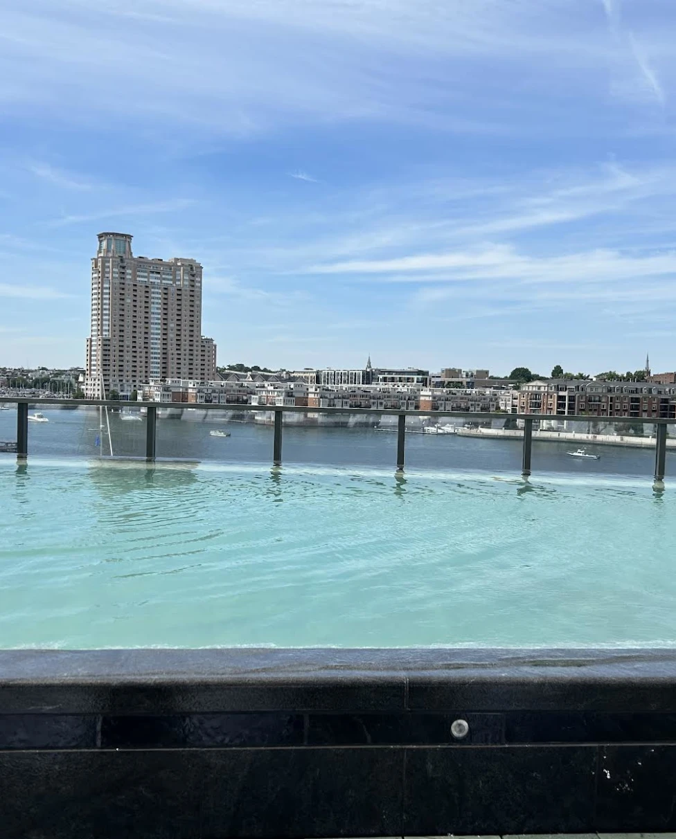 Skyscrapers reach for the sky on a bustling downtown block on a cloudy day.