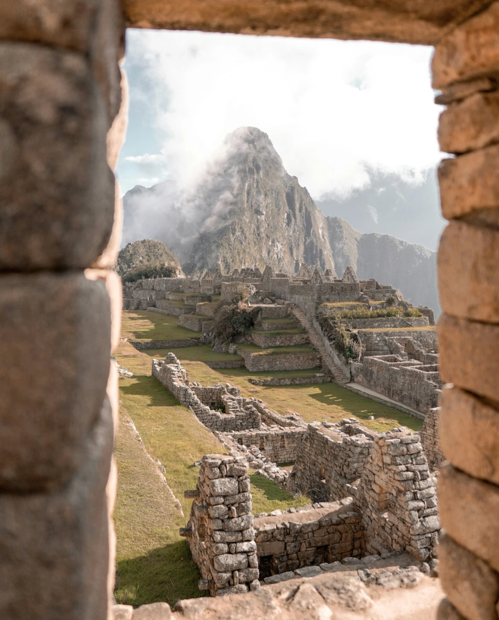 An image of Machu Picchu during the day: A timeless testament to Inca ingenuity, framed by the Andean peaks.