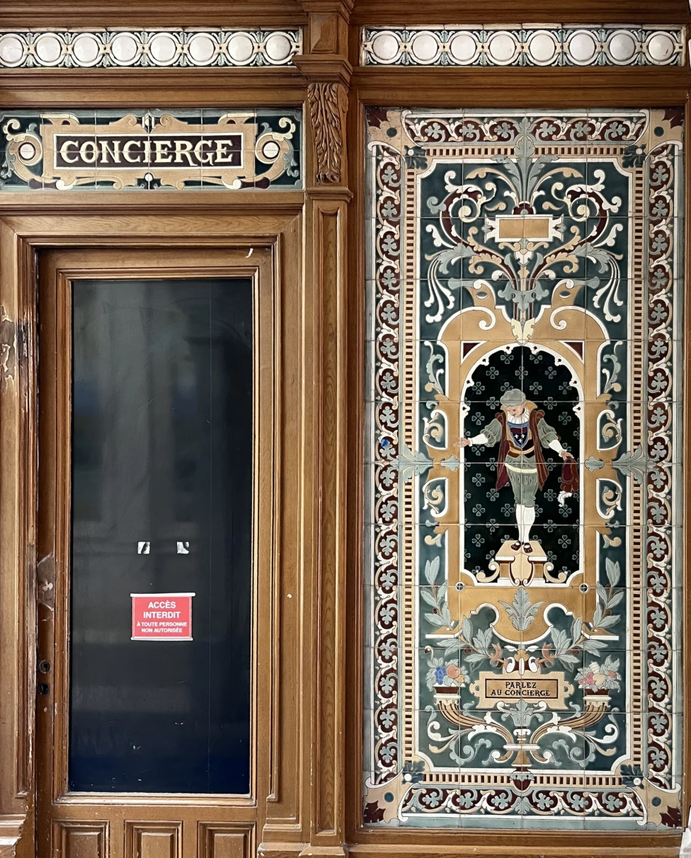 A decorative concierge door with intricate patterns on it,