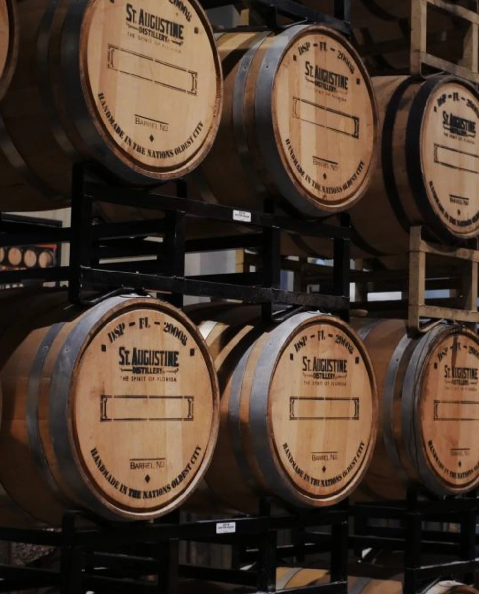 wall of stacked wooden barrels