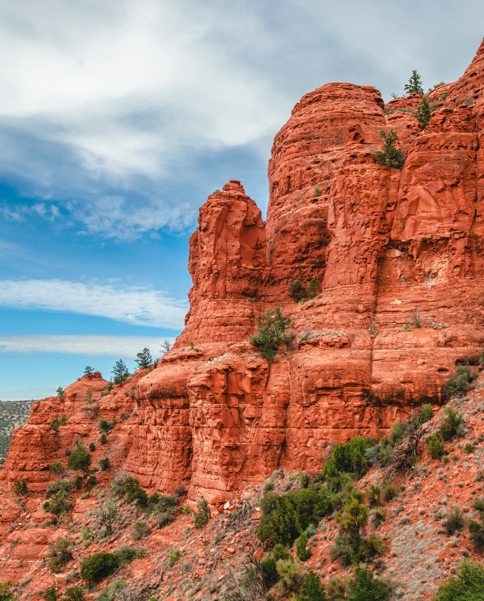 Red rock with green foliage on a cloudy day in Arizona