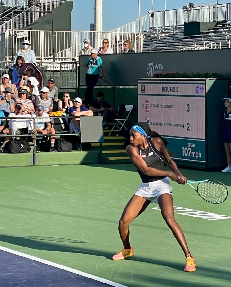 A tennis player on a court during daytime