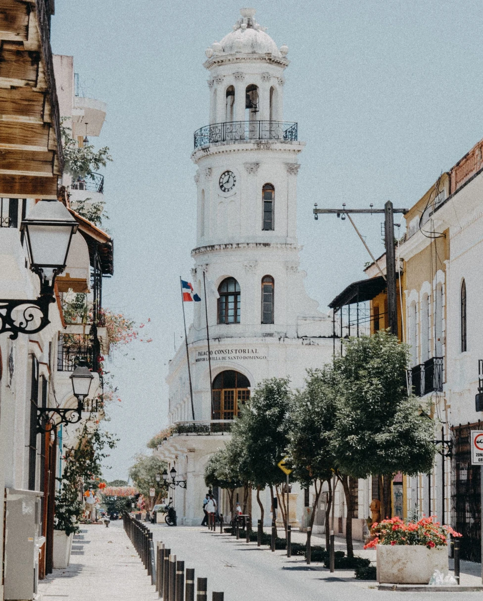 A far view of the street with a white colored building during daytime
