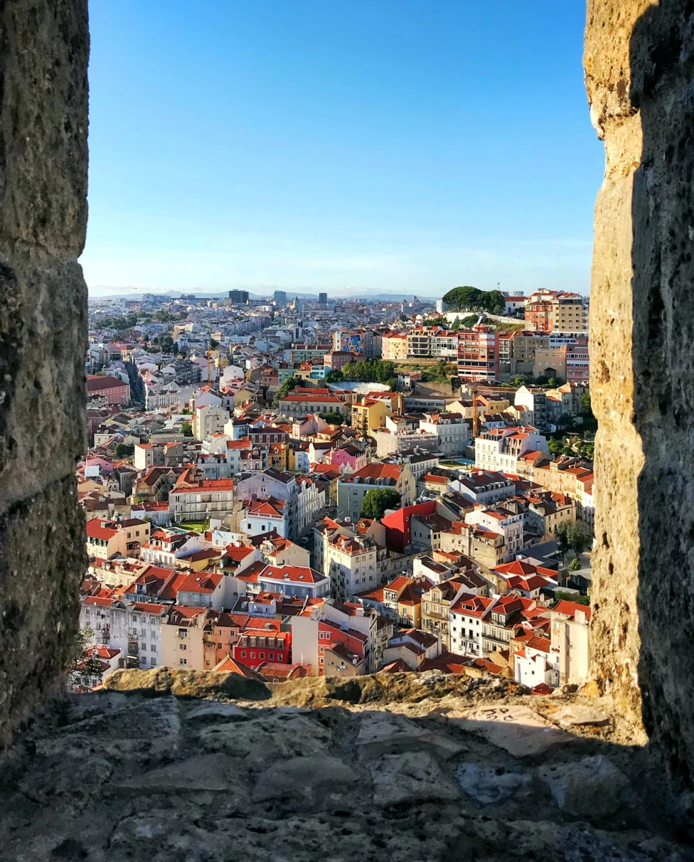 ancient city through stone wall with blue sky