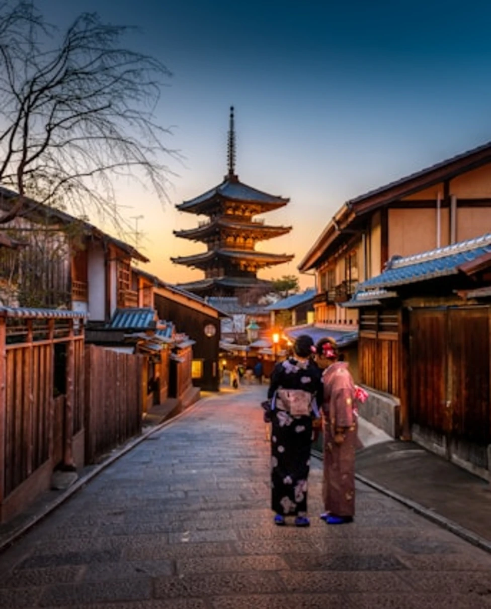 Buildings with two people standing on a street
