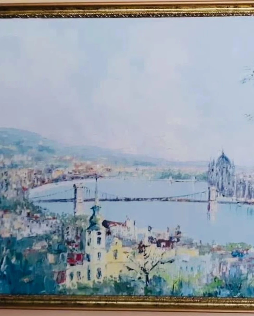 A silver statue wearing a cape.