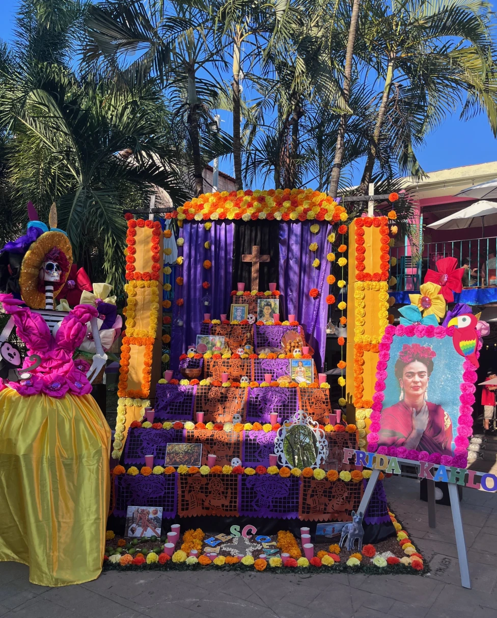 A colorful cultural display set up outside during the daytime