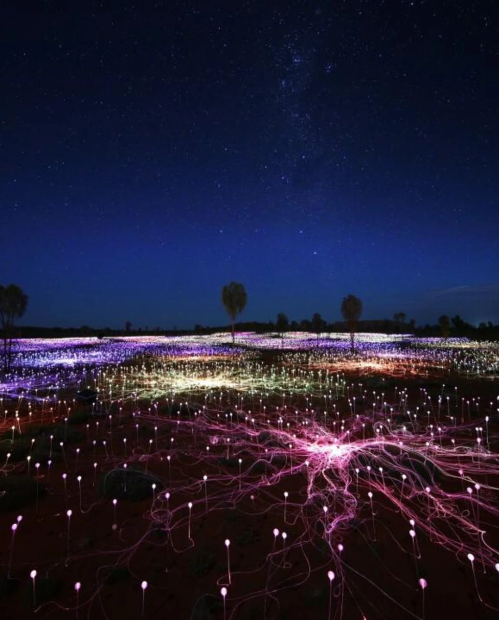 Display of lights on ground at night time.