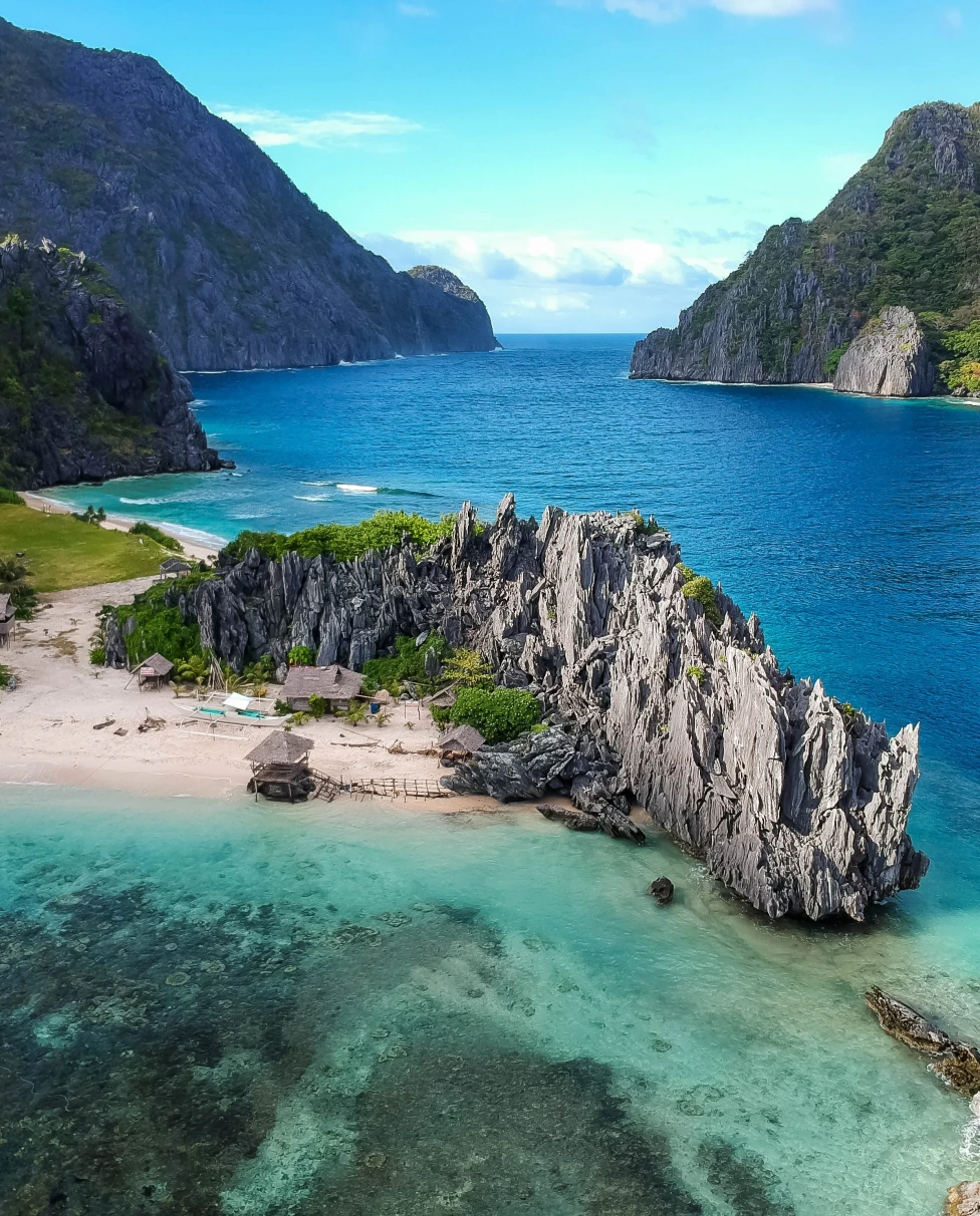 Island with Blue water and rocks at the surrounding