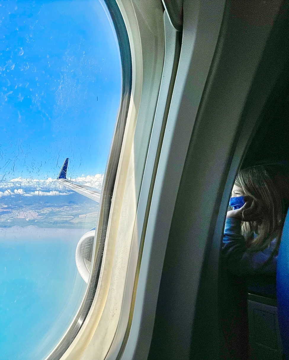 Aerial view of clouds and Panama city from the airplane.