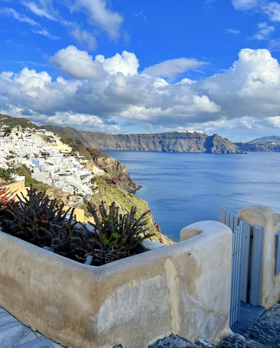 colorful houses on cliffside Greecian town