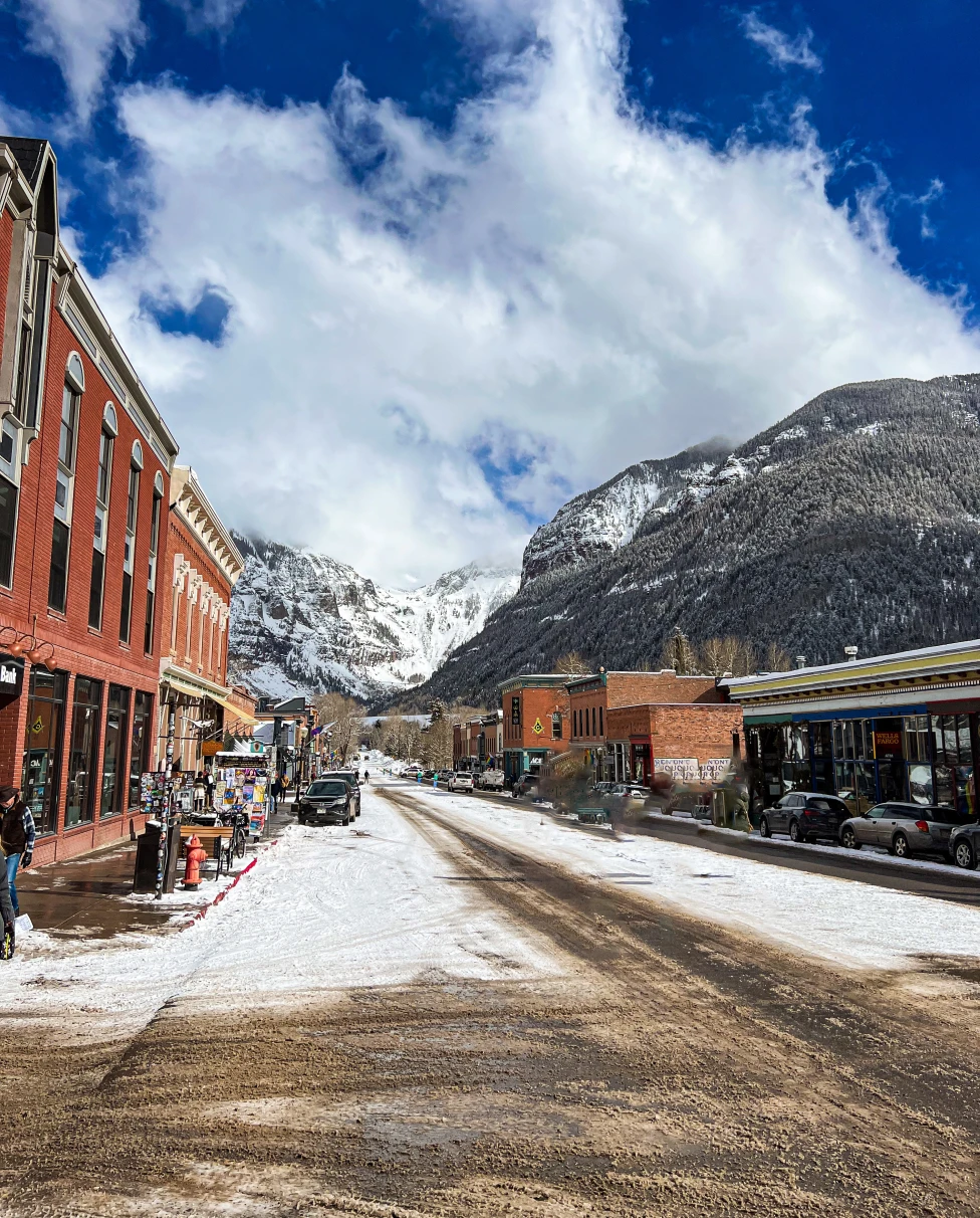 Snow capped mountains with white clouds