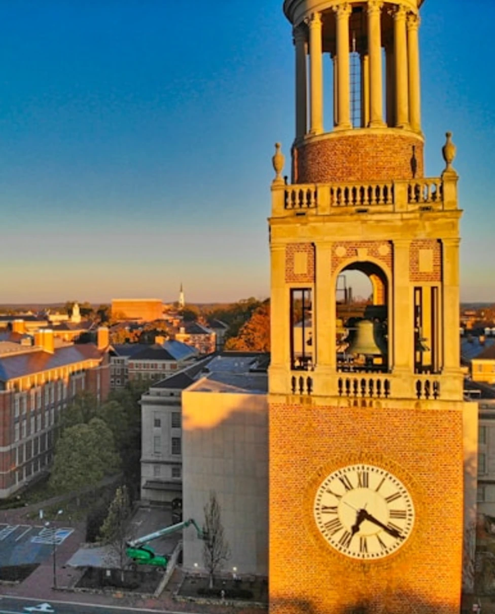 A clock town above a town during the daytime