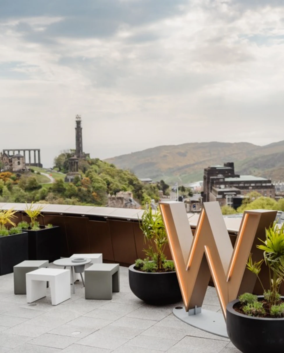 View of the city from W Edinburgh with a gold W sign on the roof.