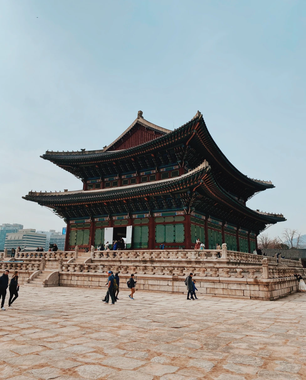people standing in front of large palace during daytime