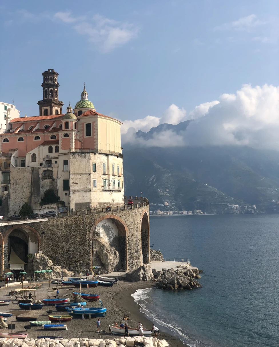 The Amalfi Coast is a breathtaking Italian paradise, characterized by stunning cliffs, charming villages, and the sparkling azure waters of the Tyrrhenian Sea.