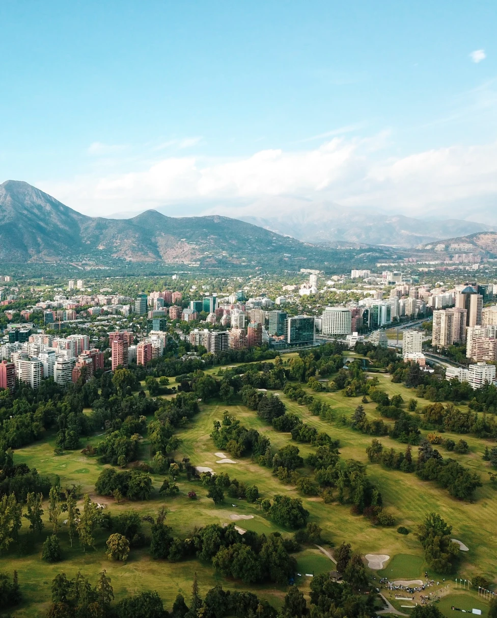 city with green mountains in the background