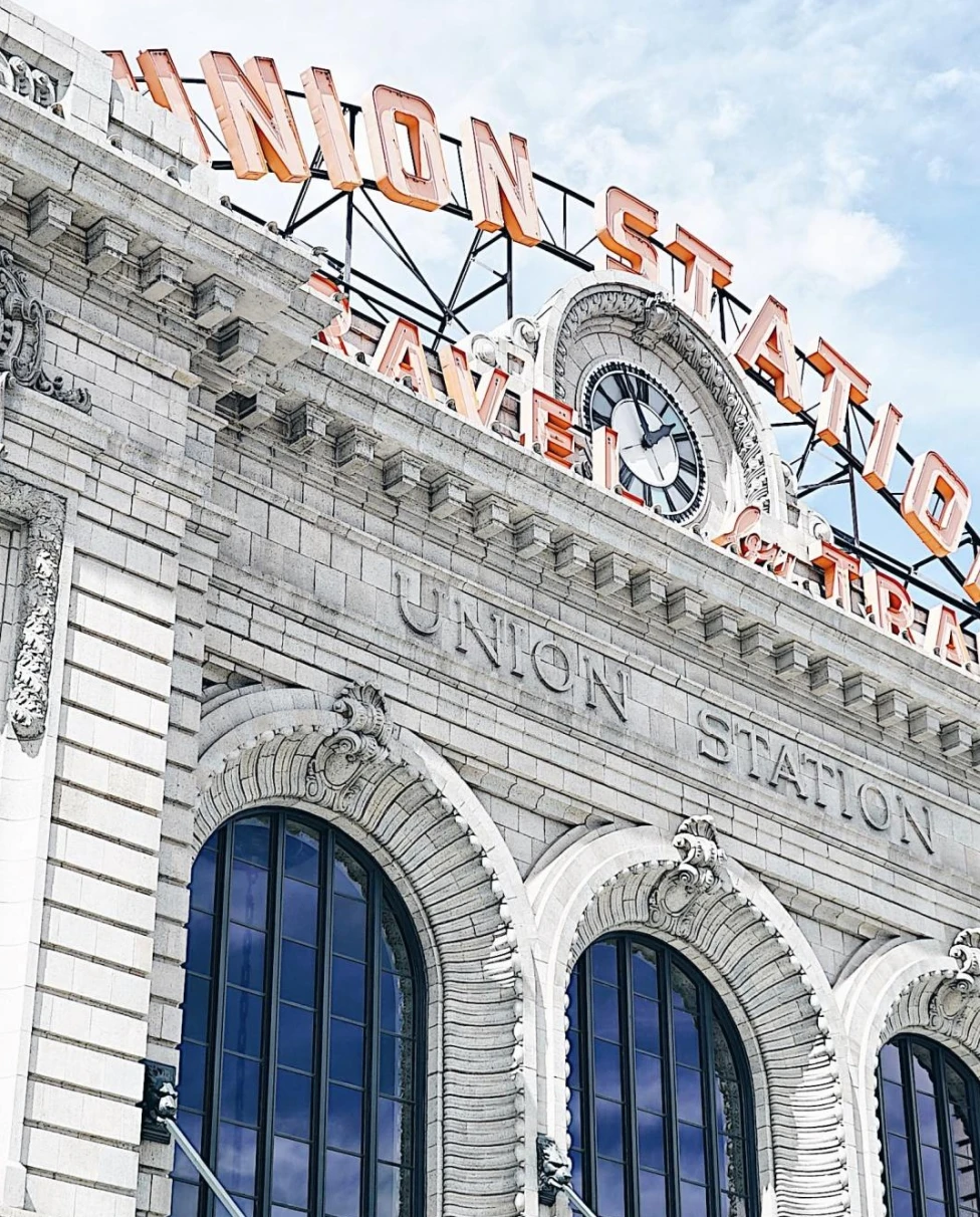 white stone building against a blue sky