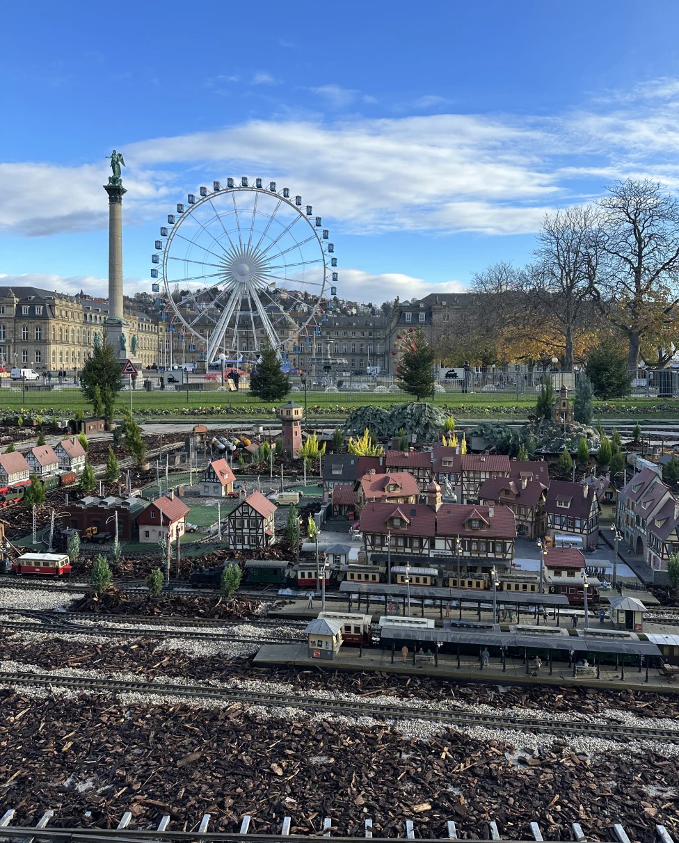 A miniature town model with a ferris wheel
