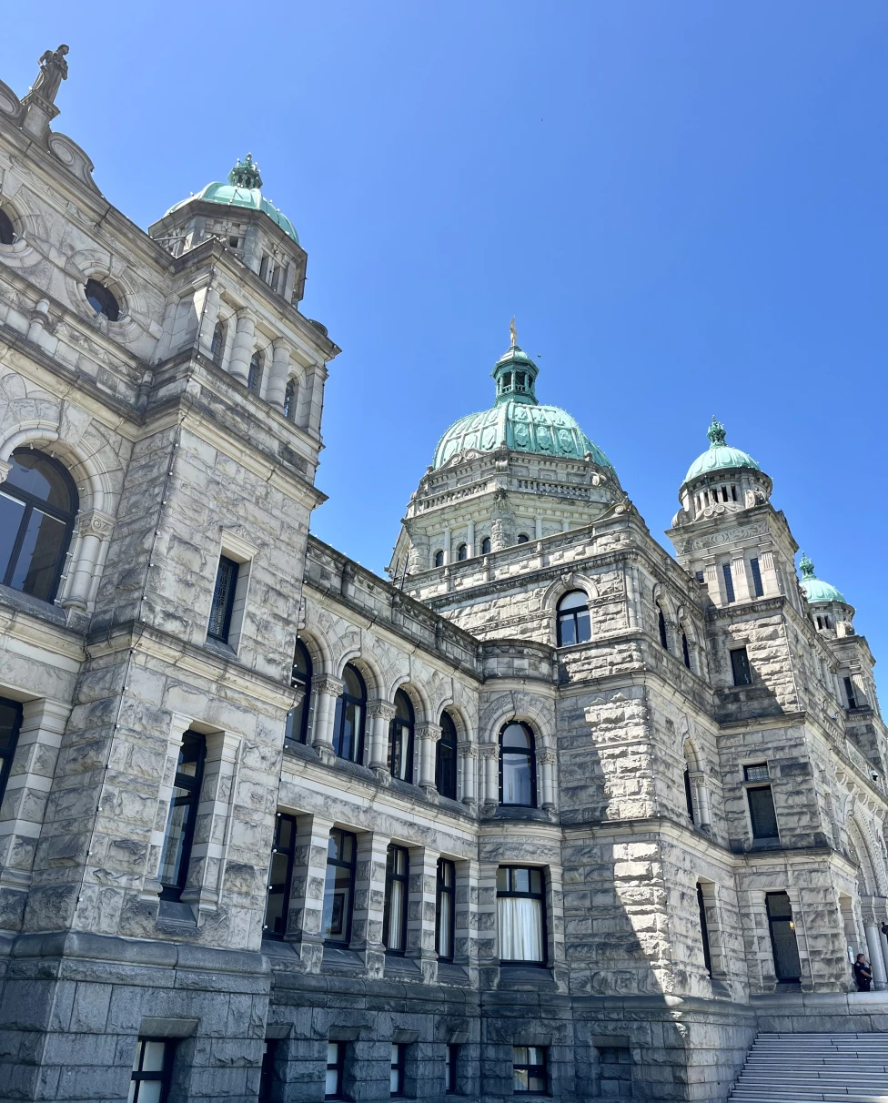 The beautiful architecture of the Parliament Building of British Columbia on a sunny day.