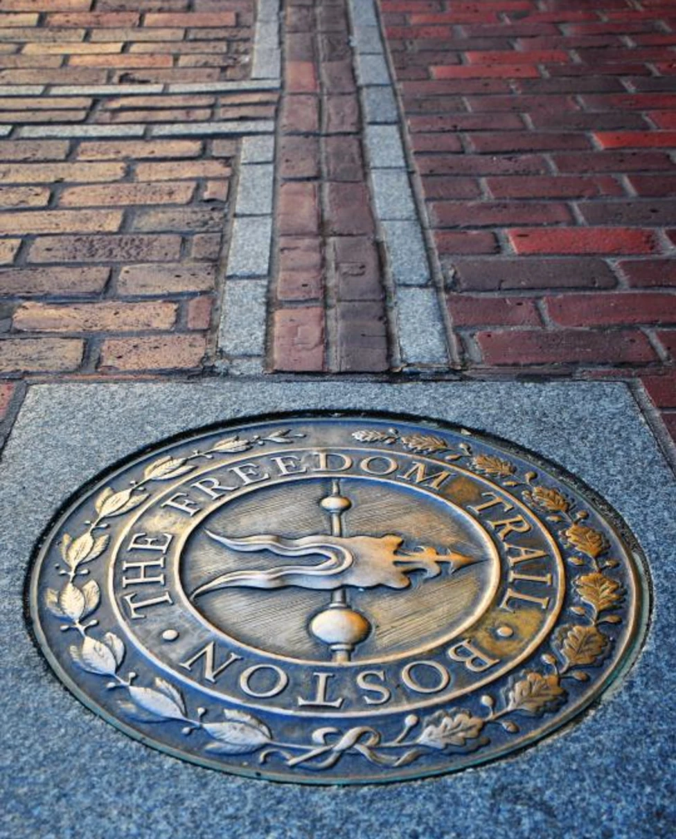 A medallion in a brick-layered road
