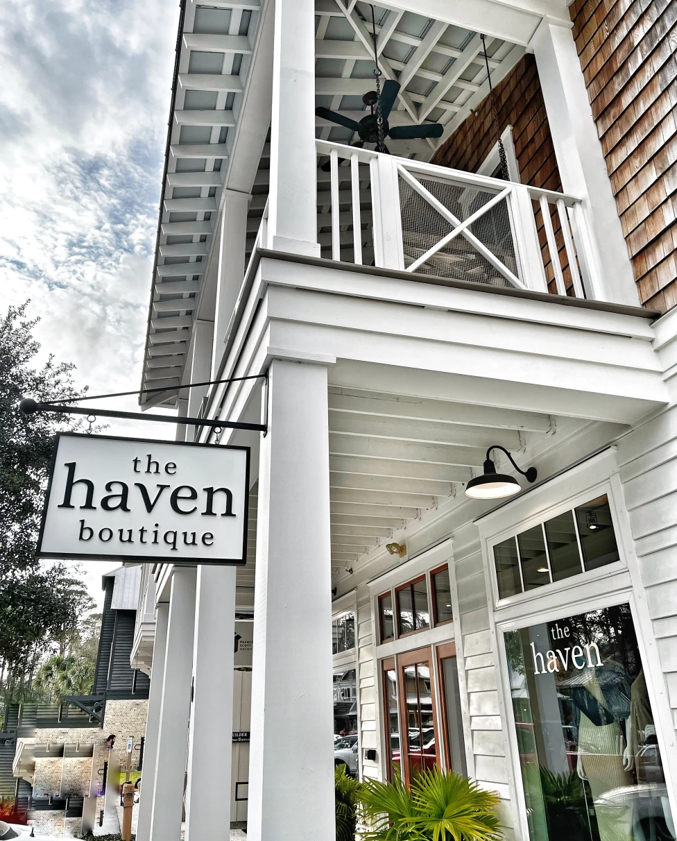 A shop with a shiplap exterior and a sign that reads "The Haven."