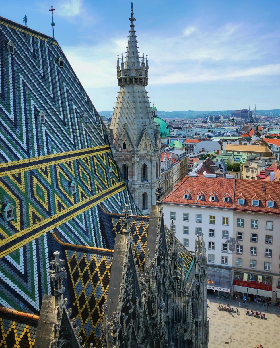 the varied and colorful rooftops of a historic city on a clear day