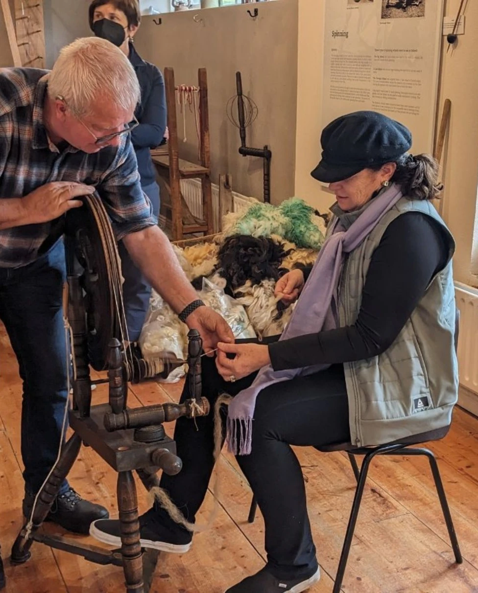 A picture of two people at Sheep wool centre.
