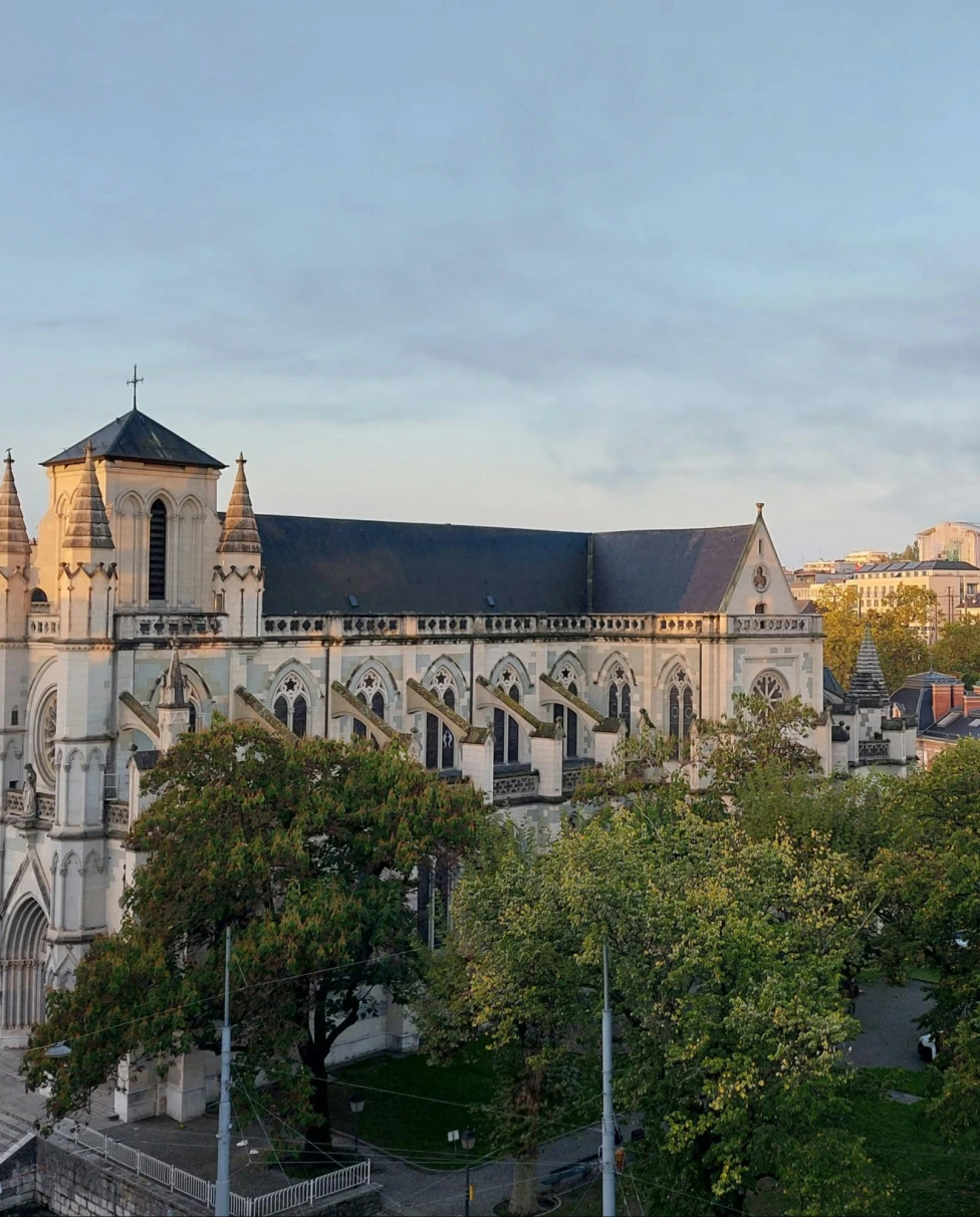 A big church with trees at front.