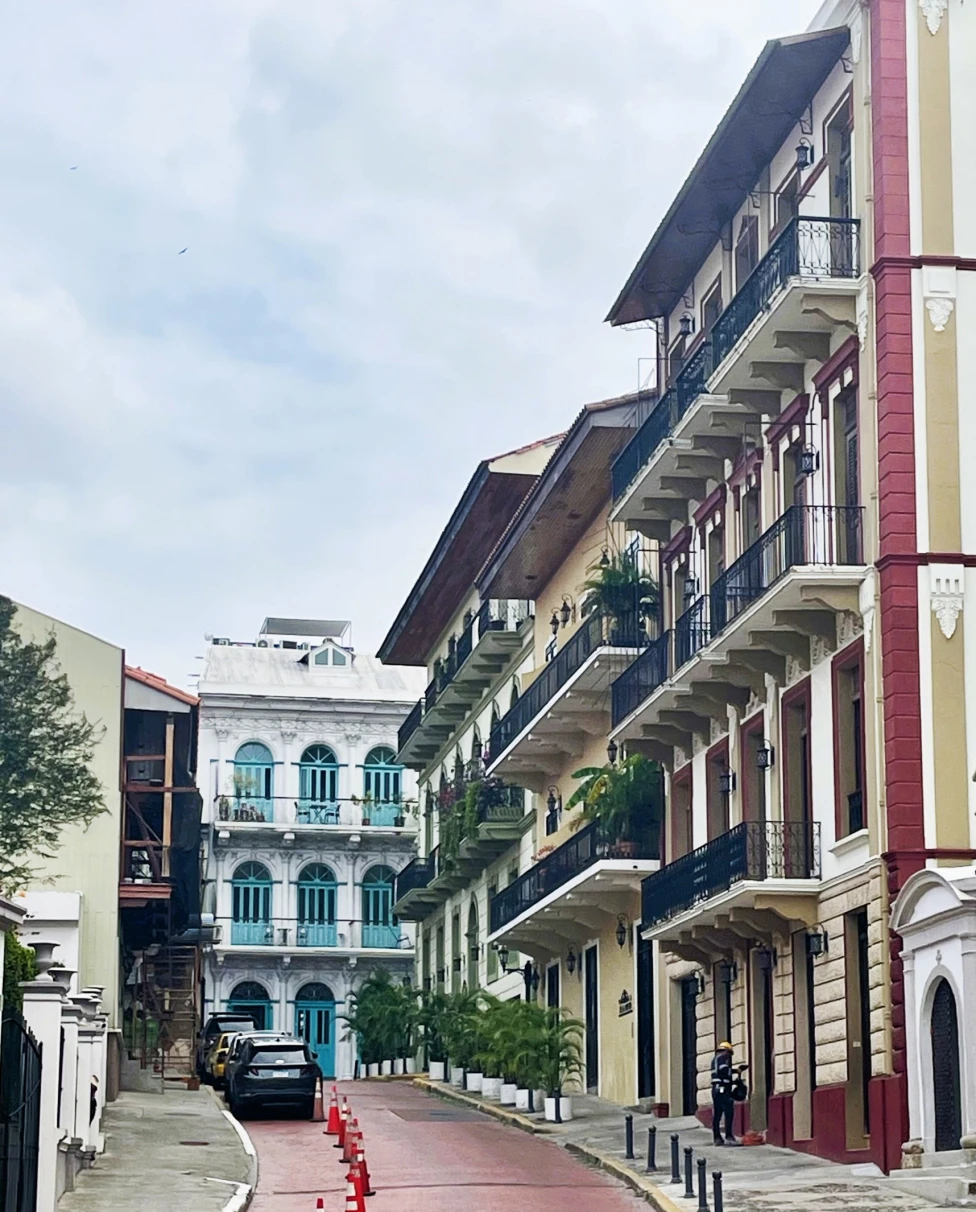 A low-angled shot of the streets with tall buildings during the daytime.
