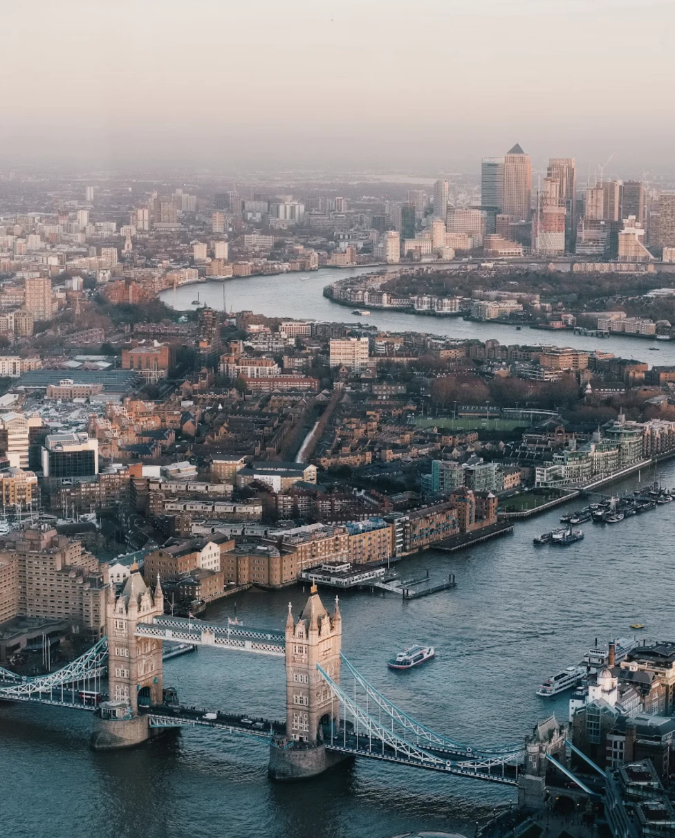 An aerial view of London's cityscape complete with a bridge and canal.