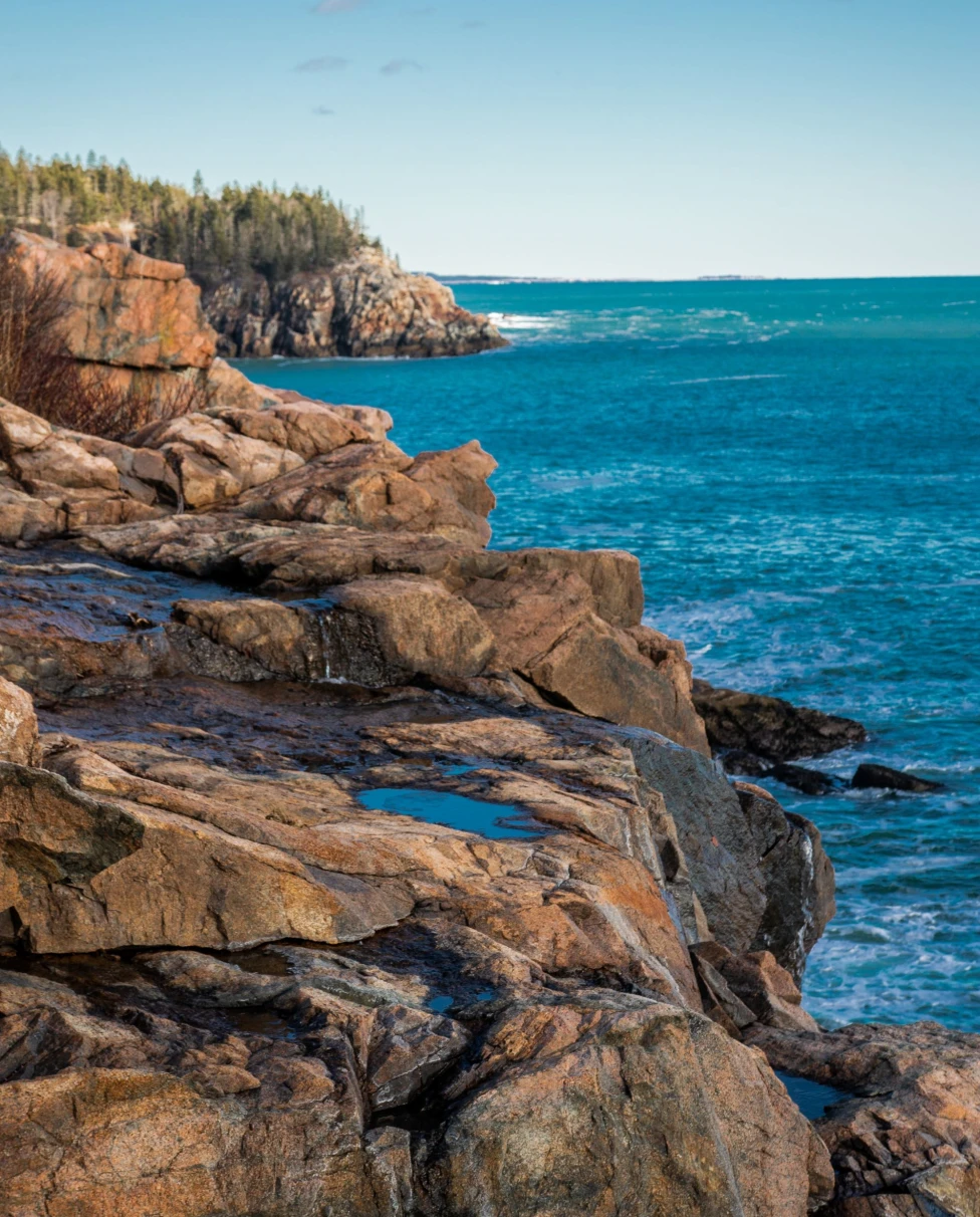rocky cliff coast and ocean on a clear sunny day