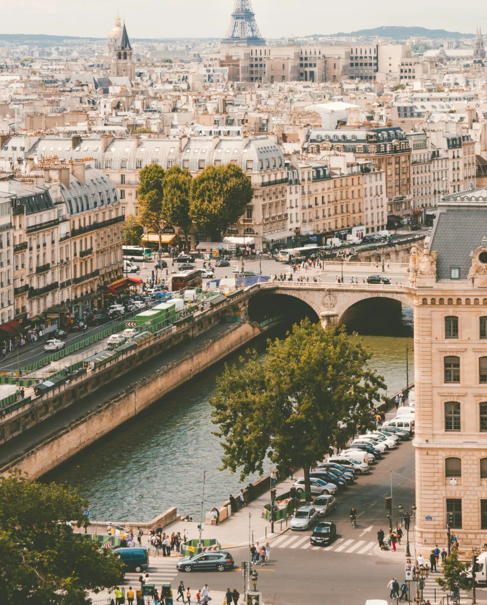 Aerial view of Paris with city  canal and buildings during daytime.