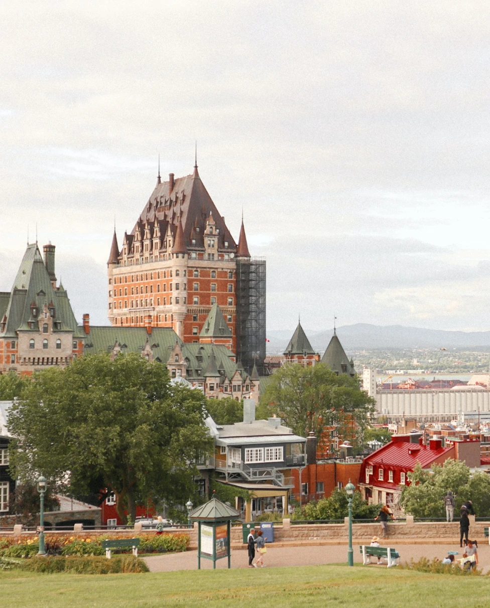 Quebec City streets in Canada with white cars and orange green and blue buildings