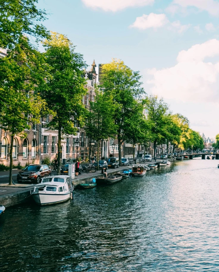 Canal and canal-side houses with boats on both sides