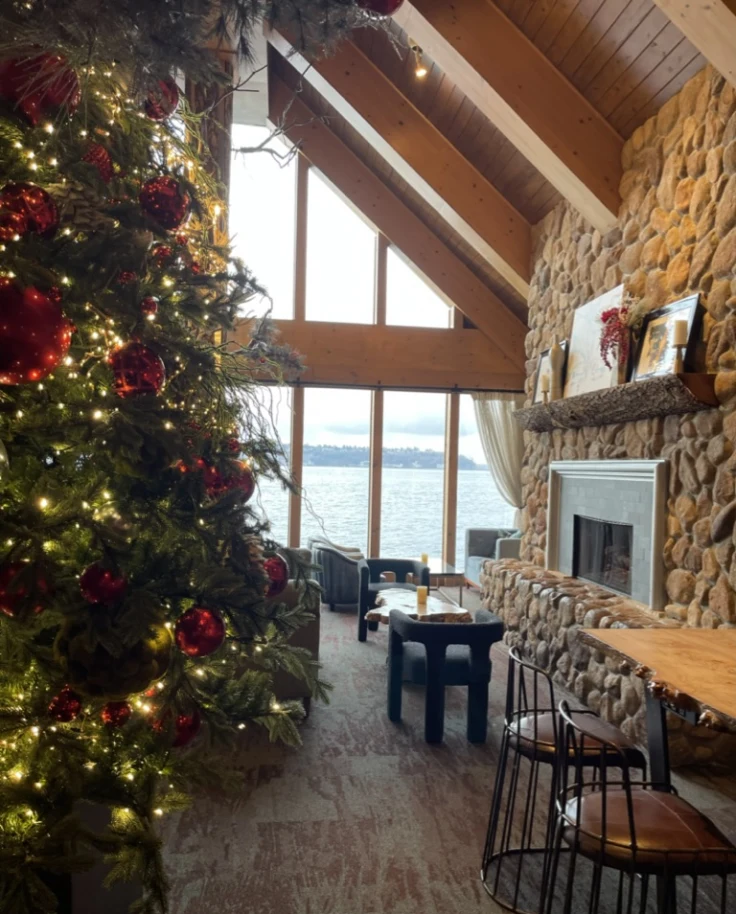 A hotel lobby with a festive tree in the middle