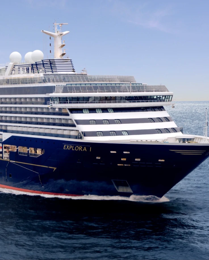 The blue and white Explora I ship in open water - Alex Sallis