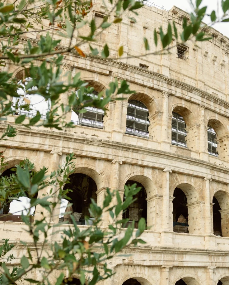 A side view of the Colosseum in one of Rome's neigborhoods