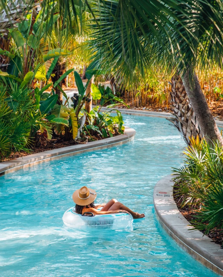 Travel advisor posing in a pool