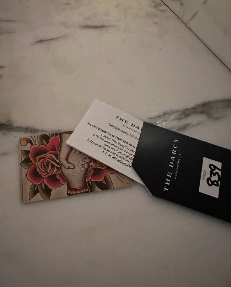 A picture of the room key and envelope for The Darcy hotel