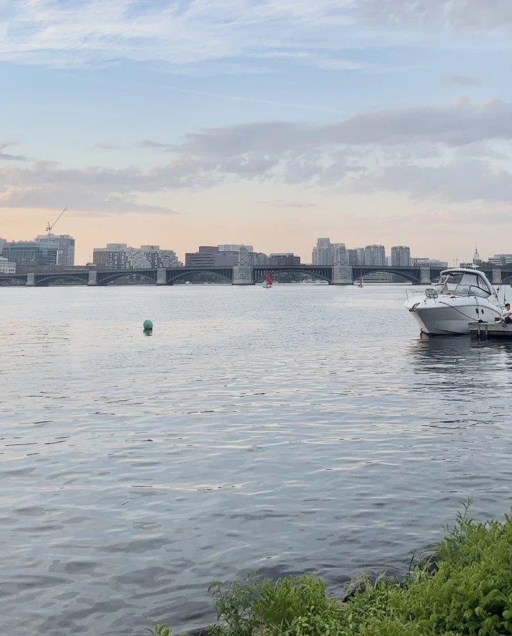 Sunset over river and Longfellow bridge in Boston