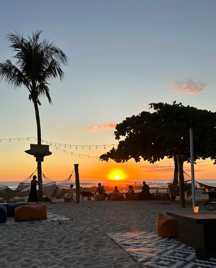 A view of a sunset at the beach.