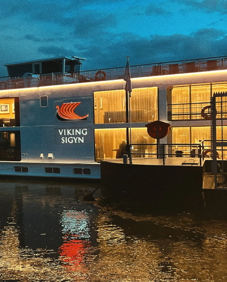 View of the cruise ship on the river during nighttime