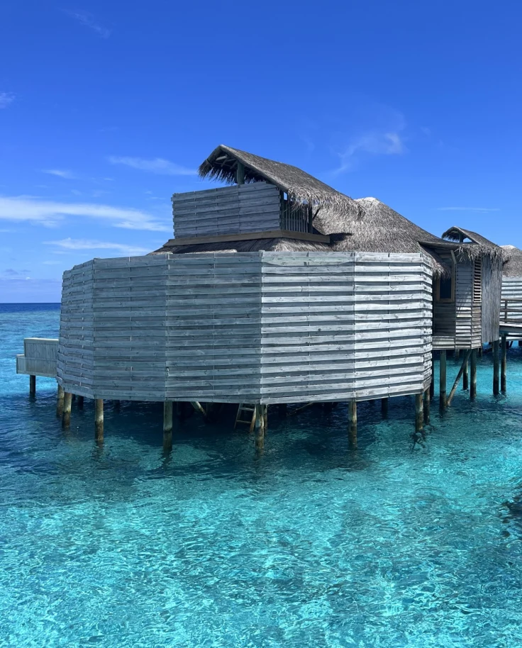 A gorgeous bungalow above the crystal clear turquoise water in the Maldives.