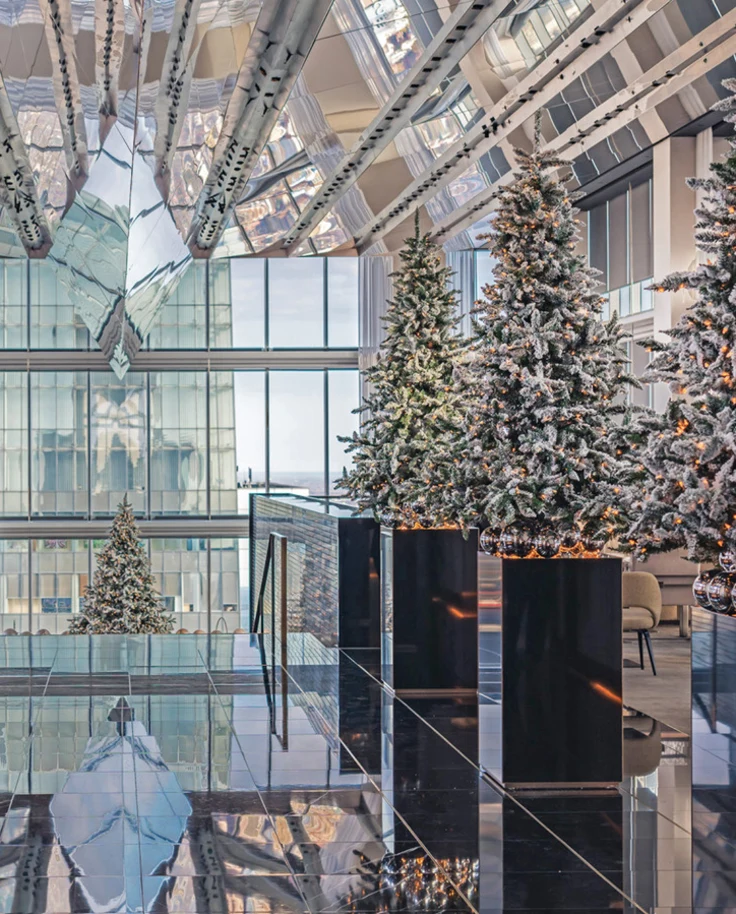 The interior of a hotel lobby with glass floors and ceilings