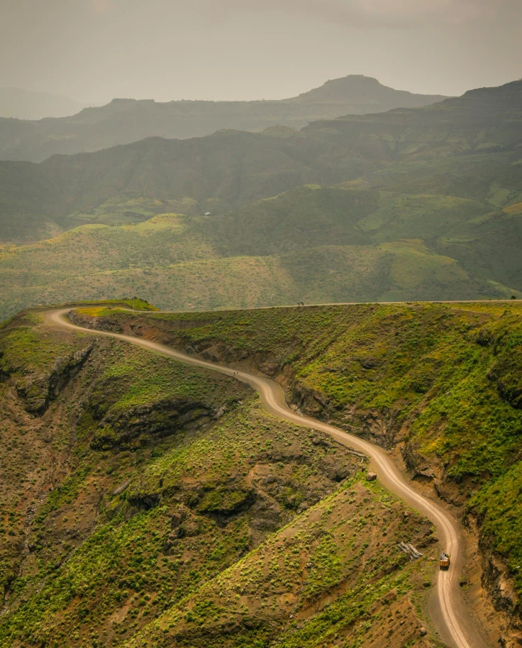 A hillside road during a hazy day