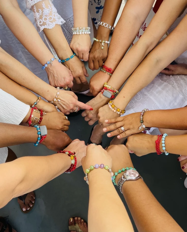 A group of hands in a circle