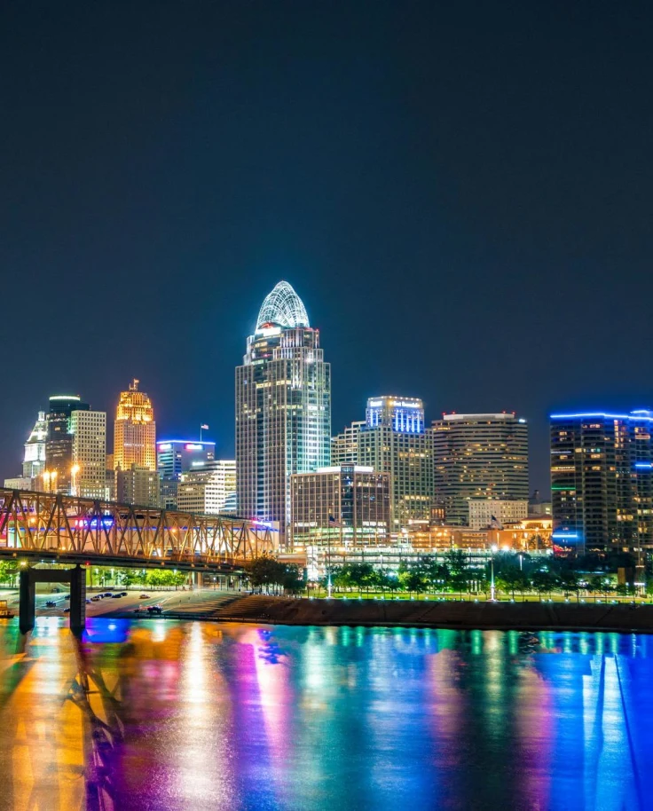 A city lit up at night with colorful lights