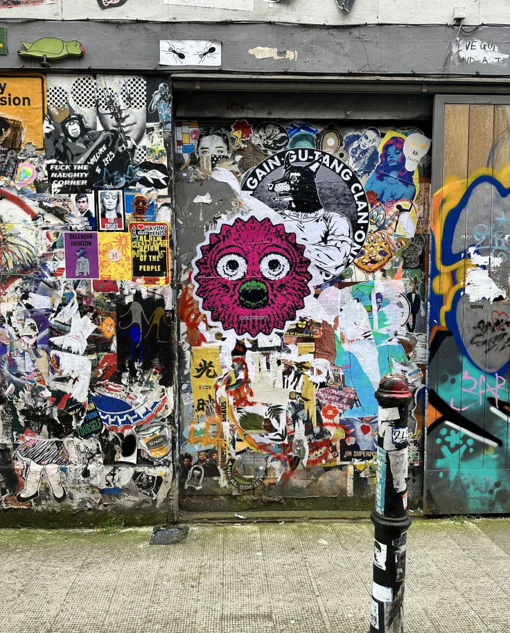 Wall with ample graffiti.